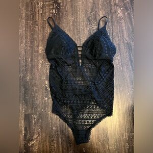 New with tags never worn lace body suit Gilly hicks
